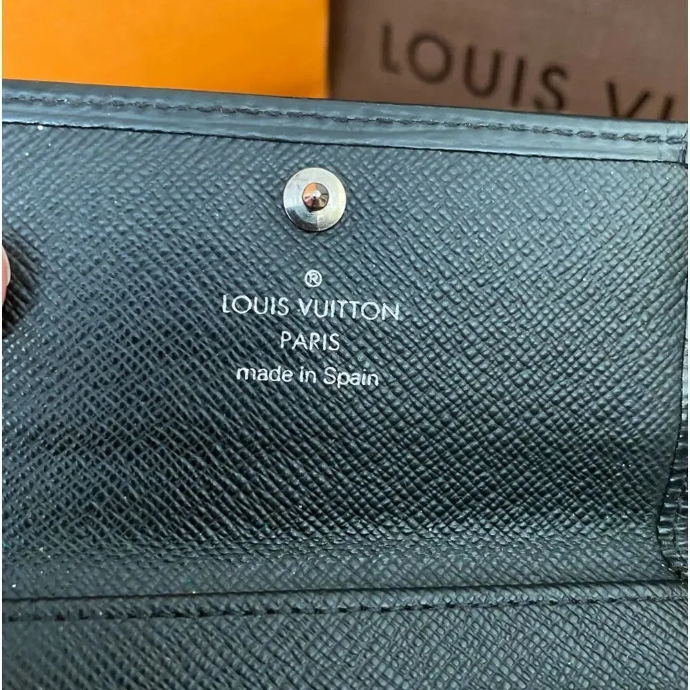 Auth LV black epi key fob is A+‎ condition. Matching wallet and bag available